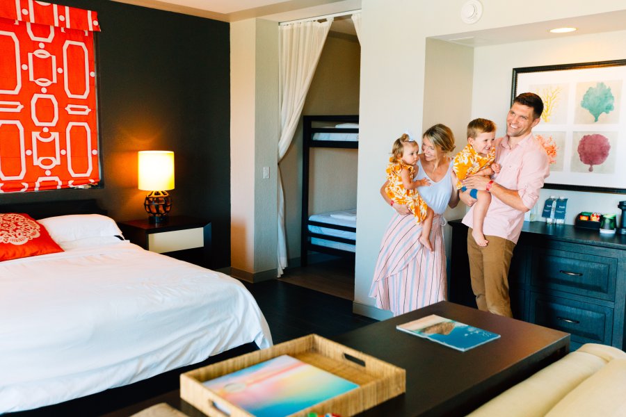 Family in hotel room.