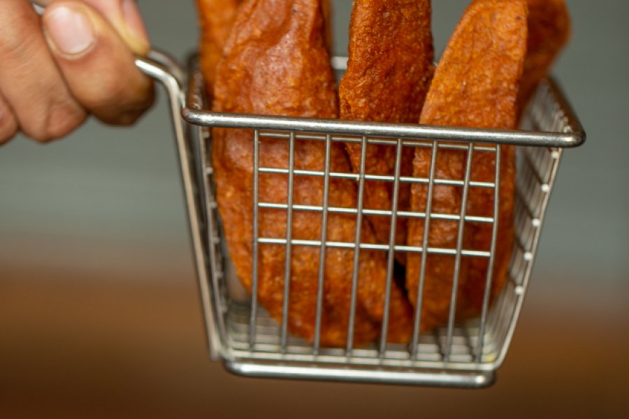 A basket filled with alcapurrias, fried traditional street food in Puerto Rico.