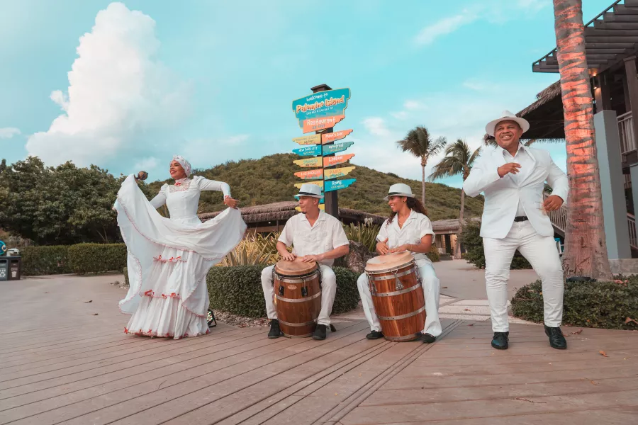 Puerto Rican dances often feature coordinated outfits and lots of colors.