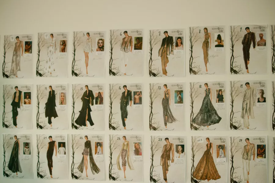 Wall of sketches and model lineup for Hermán Nadal’s La Raíz 2023 collection