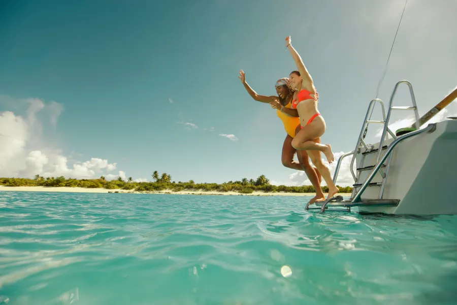 Catamaran excursion guests enjoying the crystal-clear waters of Cayo Icacos near Puerto Rico's east coast.