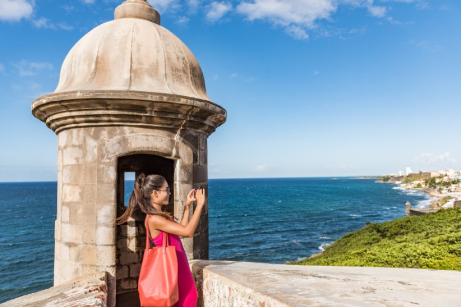 Woman taing a picture in Old San Juan.