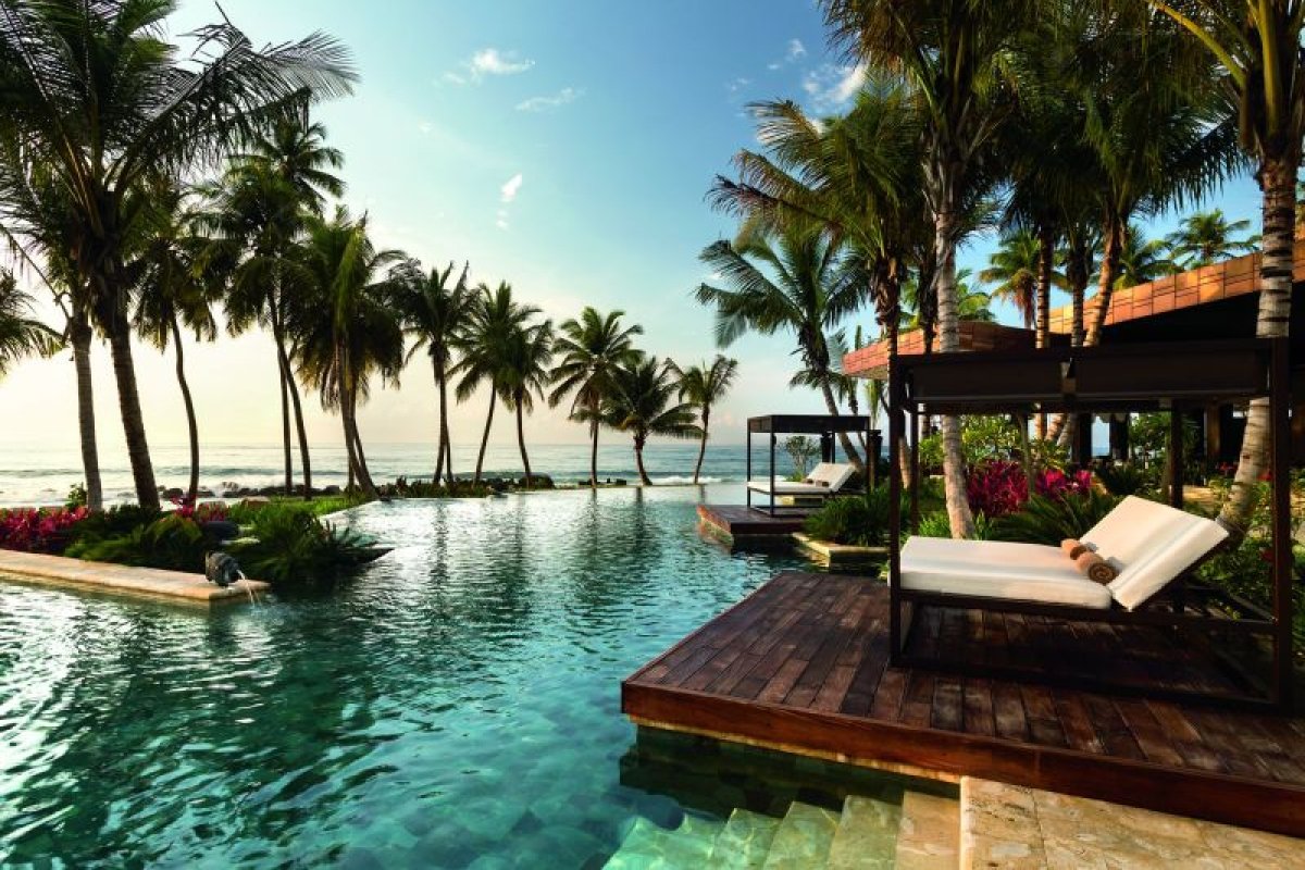Relax by the pool at the Ritz Carlton Reserve