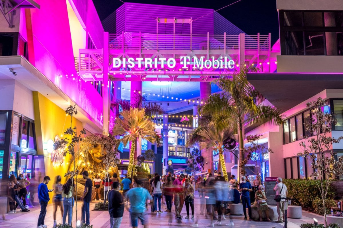 People gather at the atrium in Distrito T-Mobile