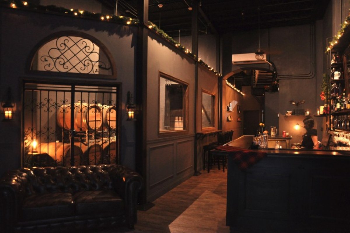 The main room at Scryer Rum Barrelhouse in Puerto Rico during the evening.