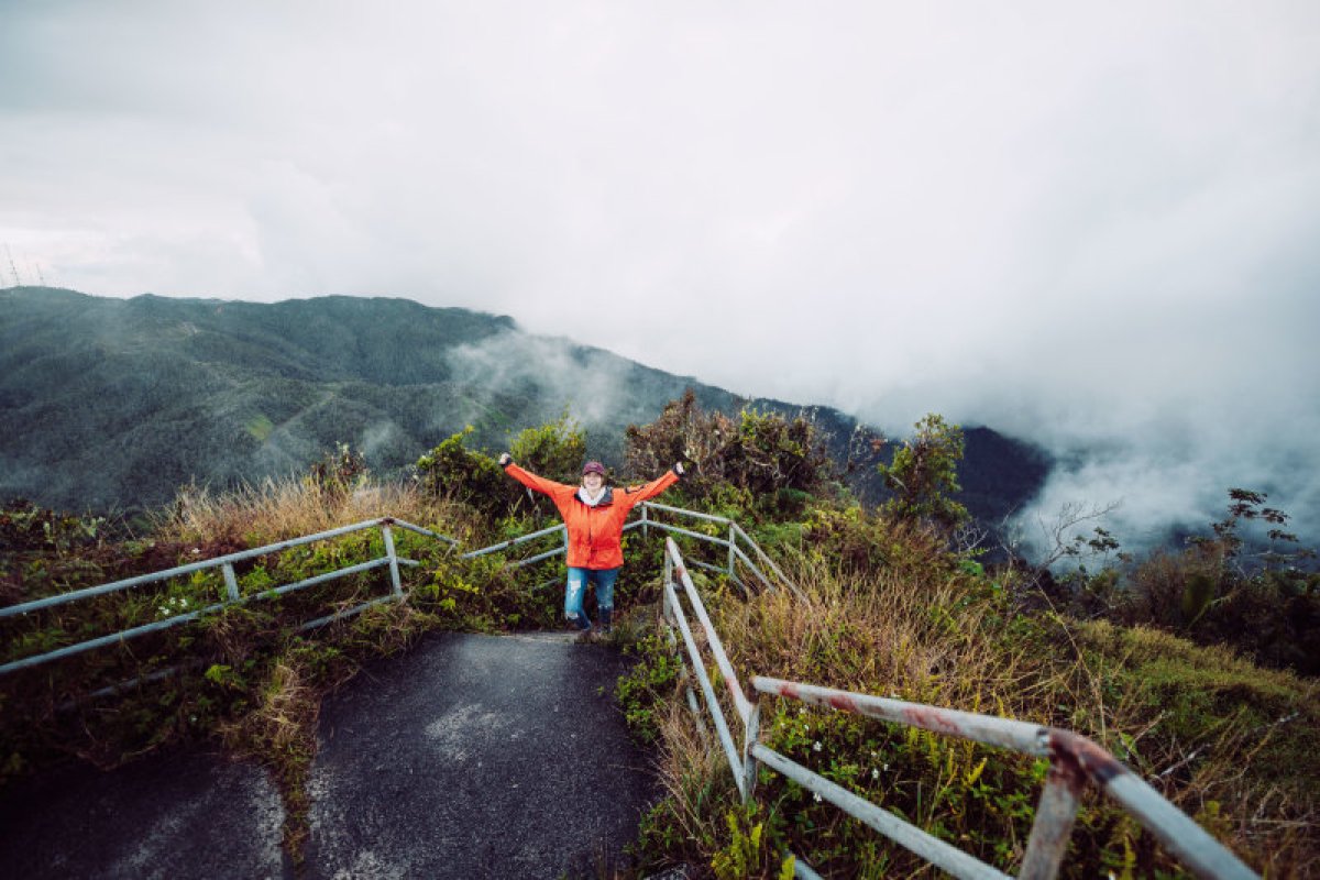 A person hikes up the mountain of the Toro Negro State Forest