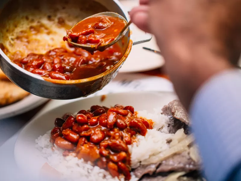 A chef plates a beautiful dish at Doña Ana Restaurant.