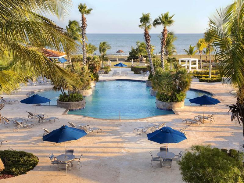 Relaxing poolside at the Hilton Ponce Golf & Casino Resort. 