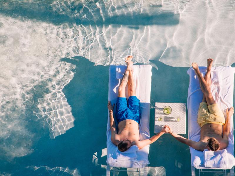 A couple enjoys the warm waters a sandy beaches of Puerto Rico