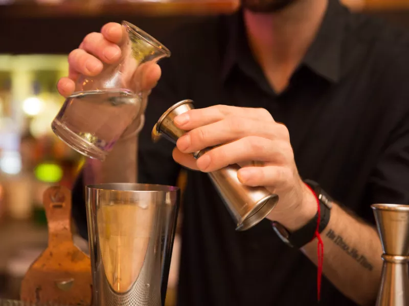 A bartender mixes cocktails at Gallo Negro 