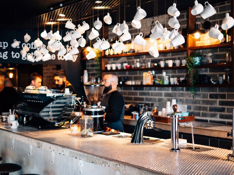 Decorative coffee cups hang from the ceiling at Bistro Cafe in Carolina.