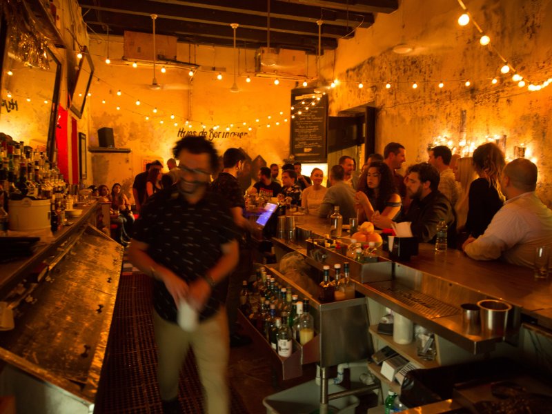 The dimly lit barroom of La Factoria in Old San Juan.