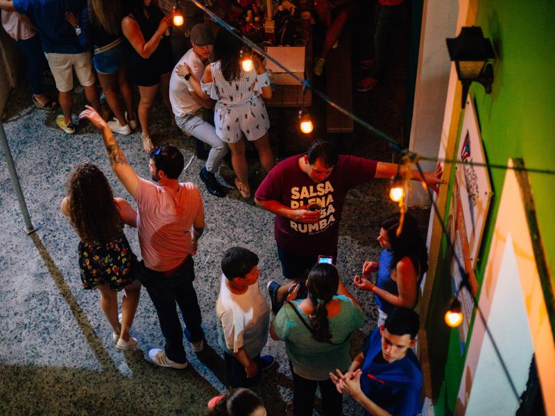 People talking and having a good time in La Placita de Santurce.