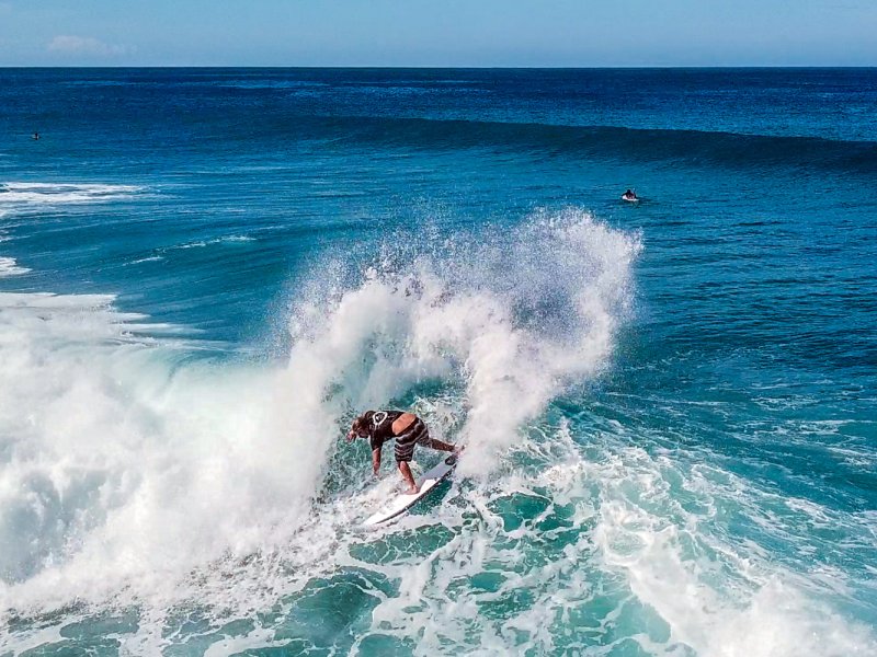 A surfer cruising a wave in Rincón.