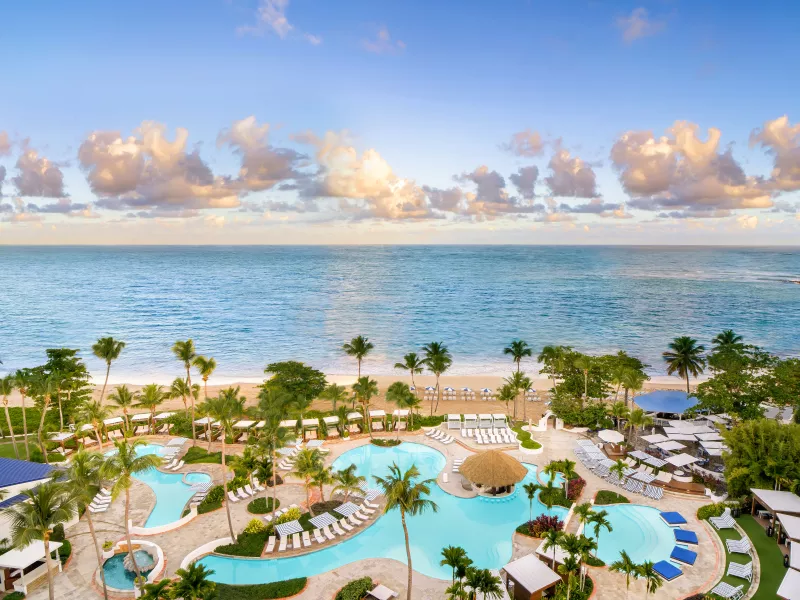 Stylish pool scene at Fairmont El San Juan, a historic favorite among the best Puerto Rico resorts.