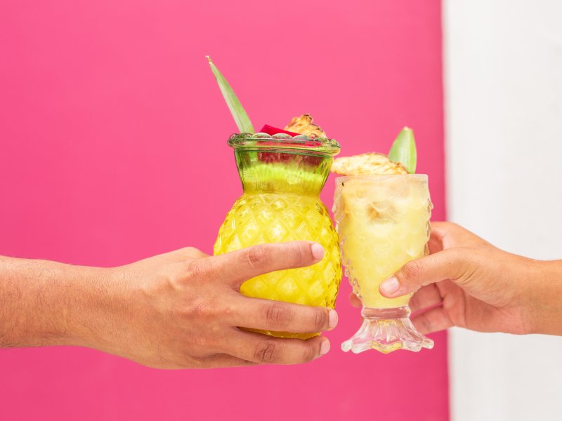 Cheers with piña colada.