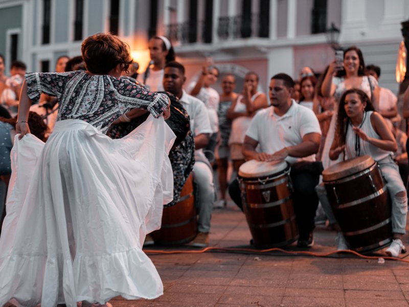 Musicians playing bomba and dancing.
