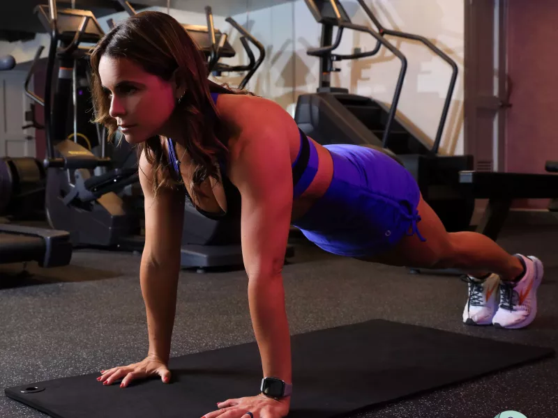 Woman exercising in a gym.
