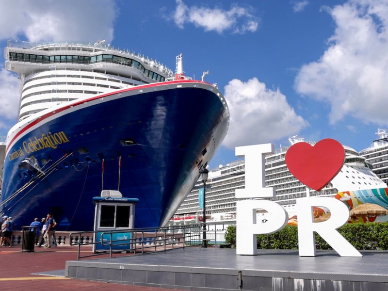 The "I Love PR" sign in front of a large cruise ship at the Old San Juan Port.