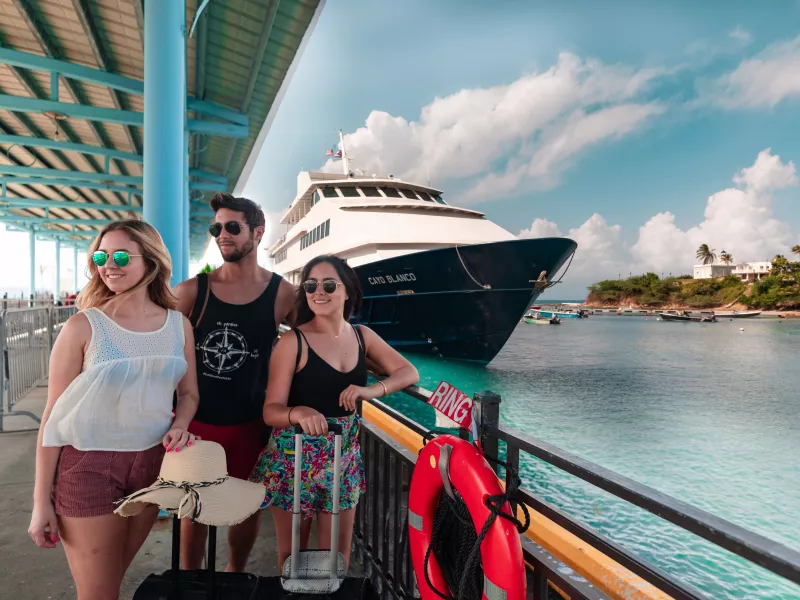 Three young people at the ferry from San Juan to Vieques & Culebra.