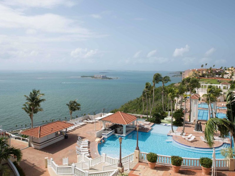 Wide view of El Conquistador Resort, which sits on a hillside and overlooks the ocean in Fajardo, Puerto Rico.