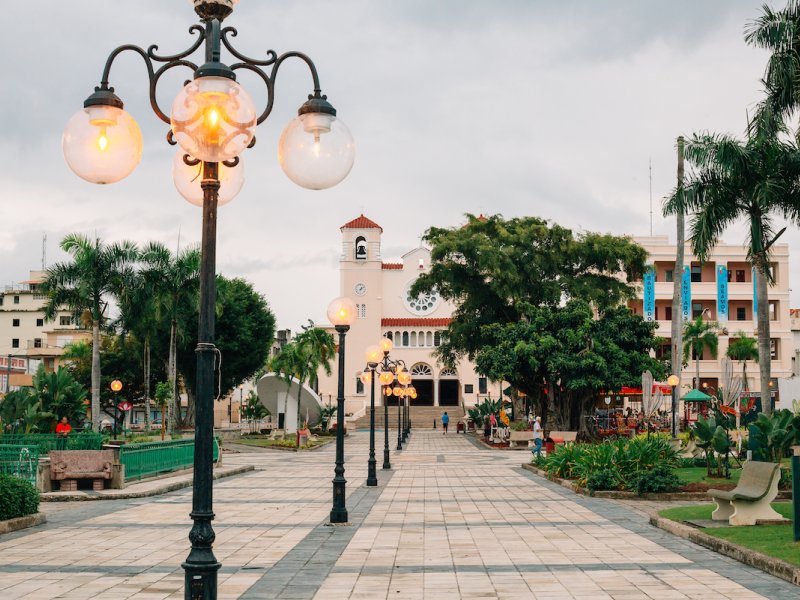 A historic plaza is lined with vintage-style lamp posts in Caguas, Puerto Rico.