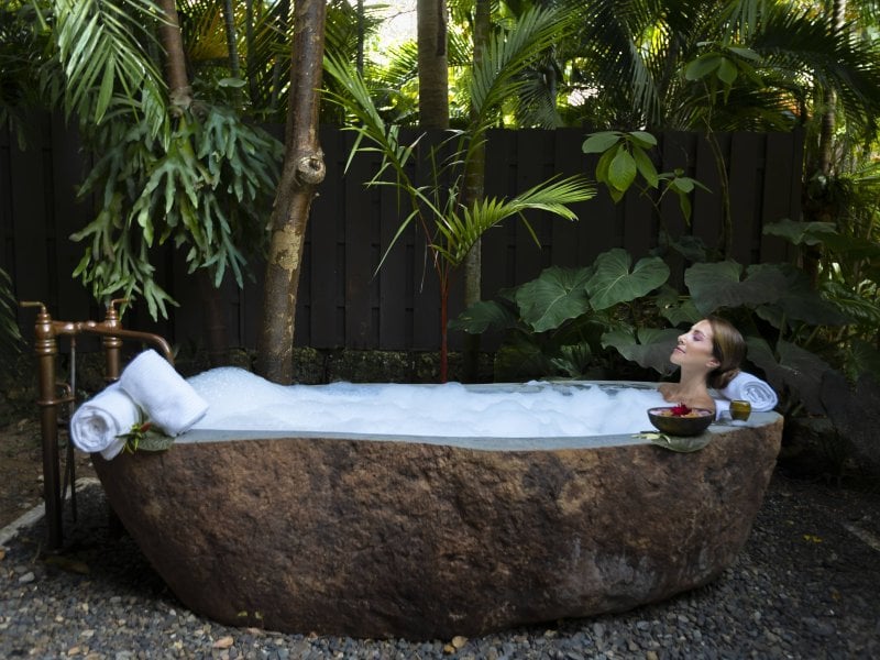 Woman in spa bath.
