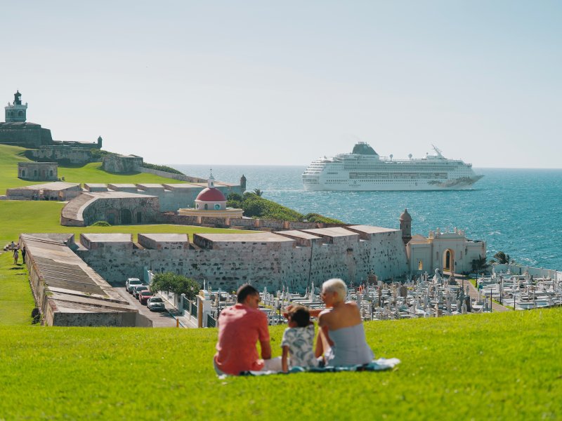 Family looking at cruise ship. 