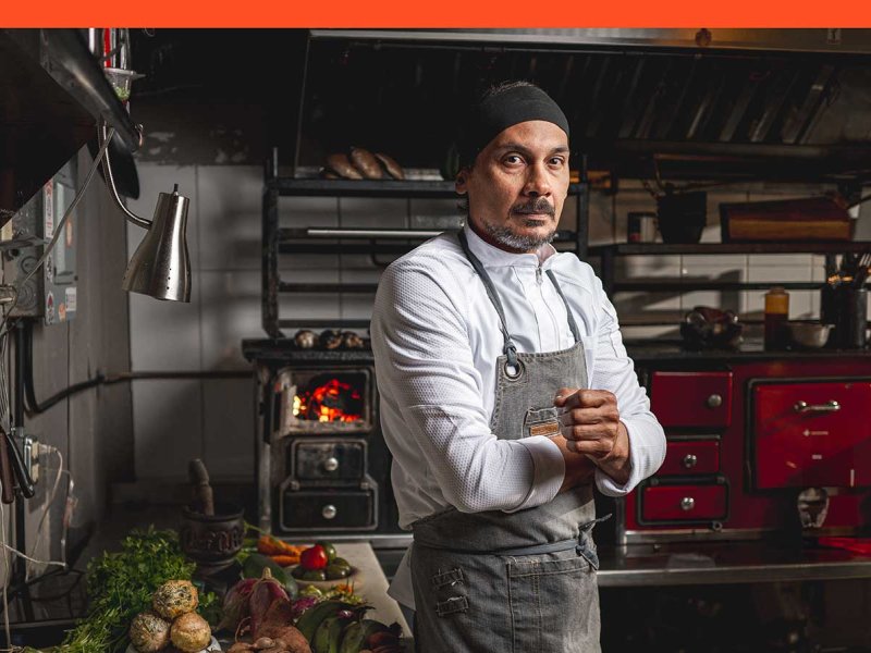 Chef Carlos Portela poses in his kitchen