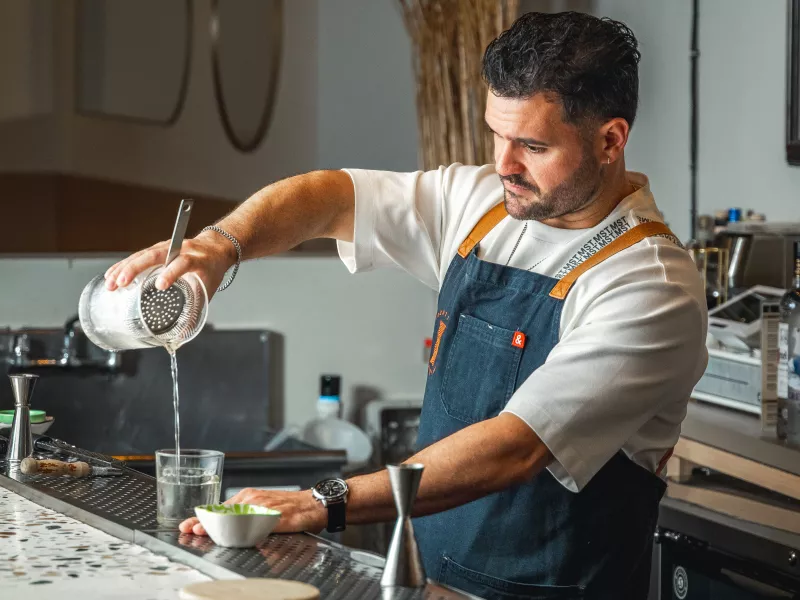 Mixologist Stephen Alonso mixing a cocktail.