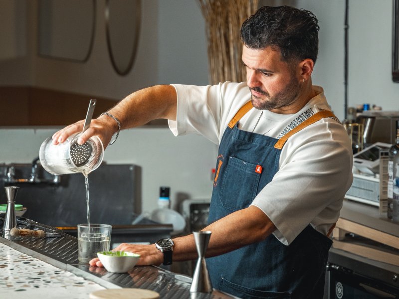 Mixologist Stephen Alonso mixing a cocktail.