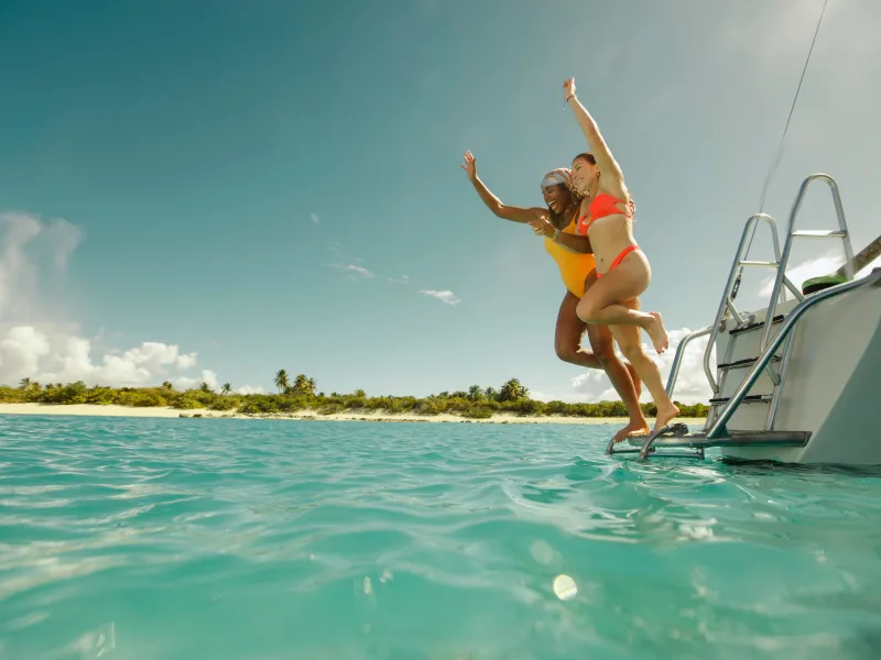 Catamaran excursion guests enjoying the crystal-clear waters of Cayo Icacos near Puerto Rico's east coast.