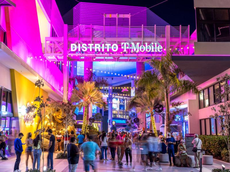 People gather at the atrium in Distrito T-Mobile