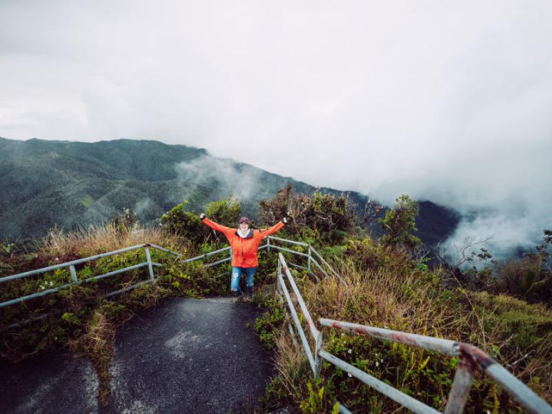 A person hikes up the mountain of the Toro Negro State Forest
