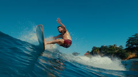 A surfer riding a wave at Maria’s Beach in Rincón, Puerto Rico.