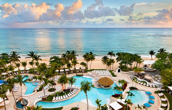 El San Juan Hotel's pool and beach at sunrise.