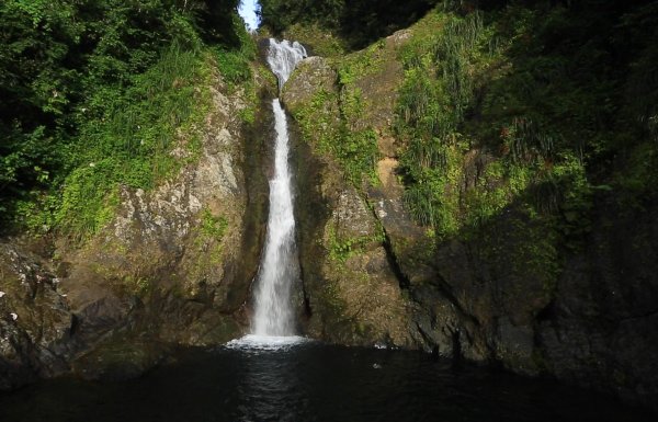 Dona Juana waterfall cascading into the lake below.