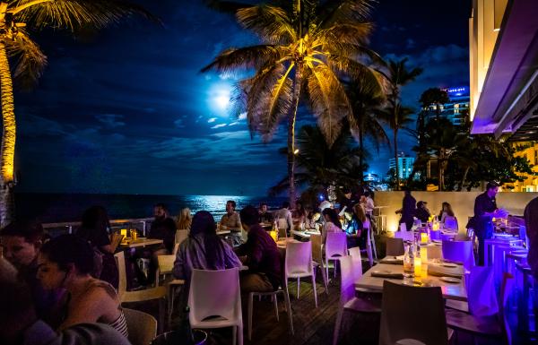 Diners enjoy their meal as well as the view at Oceano.