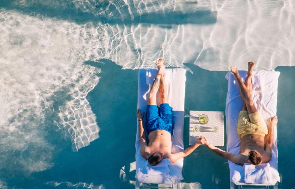 A couple enjoys the warm waters a sandy beaches of Puerto Rico