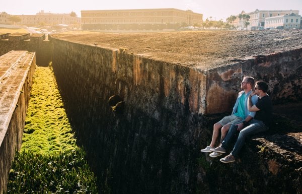 A couple enjoys the view from old ruins
