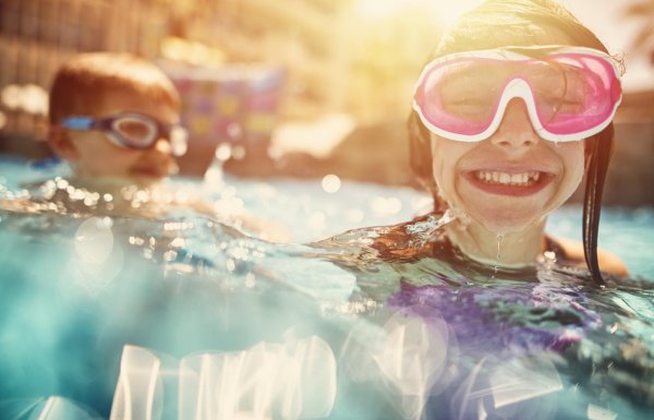Kids enjoying a pool.