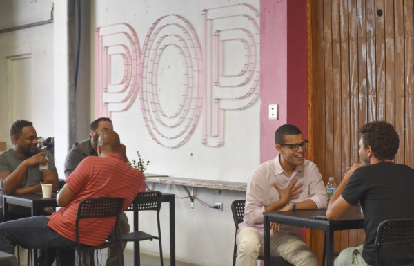 people sitting at tables and talking in POP in Santurce