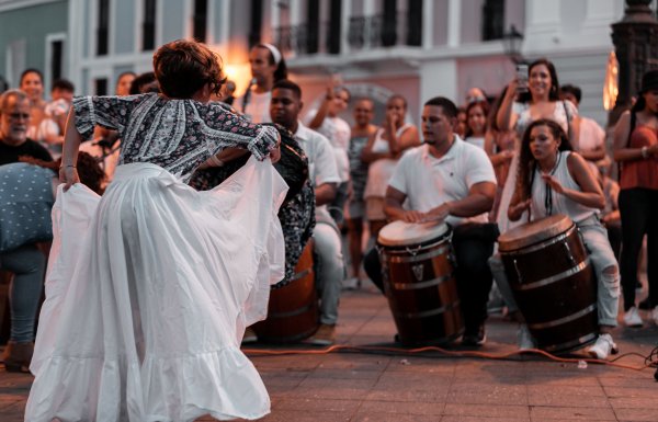 Musicians playing bomba and dancing.