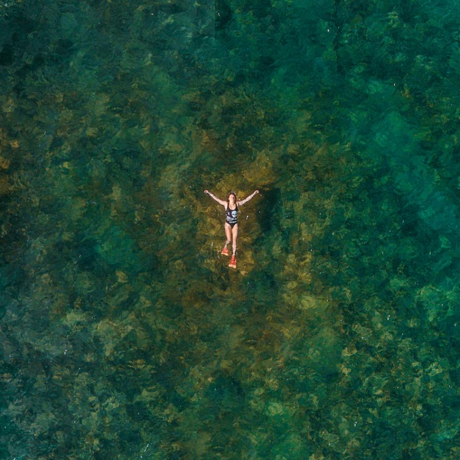 A woman enjoys a warm day in the ocean at Cabo Rojo.