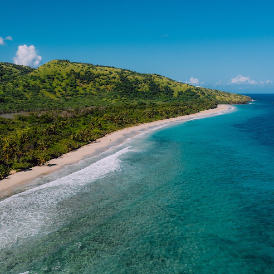 Waves crash along a beach in Culebra. 