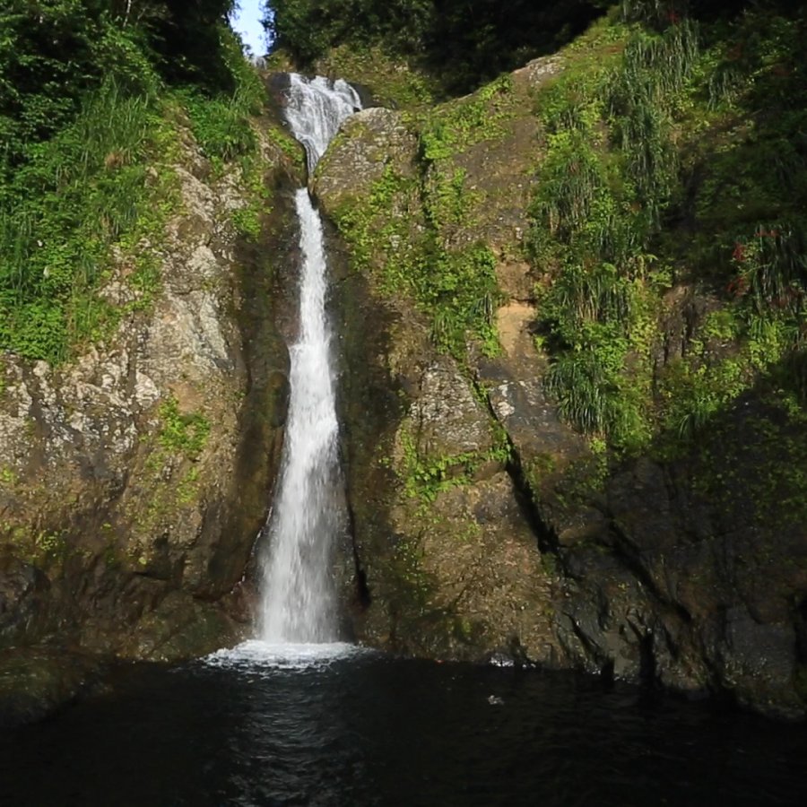 Dona Juana waterfall cascading into the lake below.