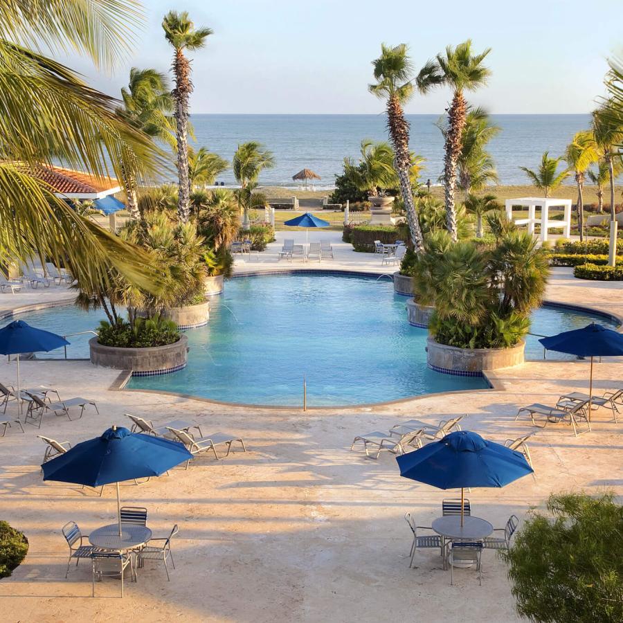 Relaxing poolside at the Hilton Ponce Golf & Casino Resort. 