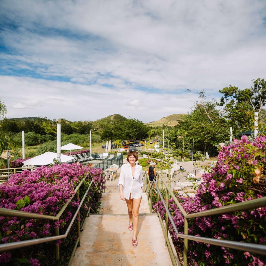 A woman walking along the Hot Springs in Coamo.