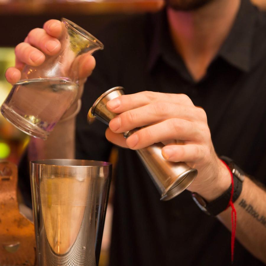 A bartender mixes cocktails at Gallo Negro
