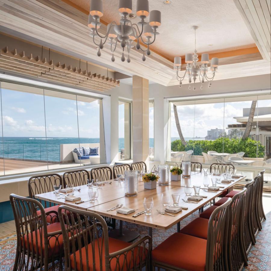 A private dining room with ocean views at Restaurant Ola in the Condado Vanderbilt Hotel.